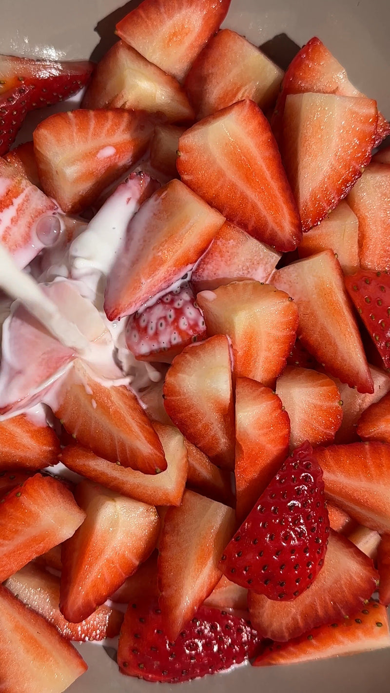 Close-up of sliced strawberries on a white background